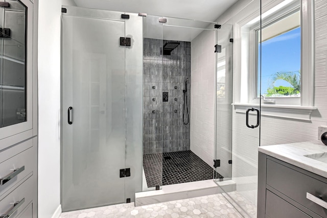 bathroom featuring a stall shower and vanity