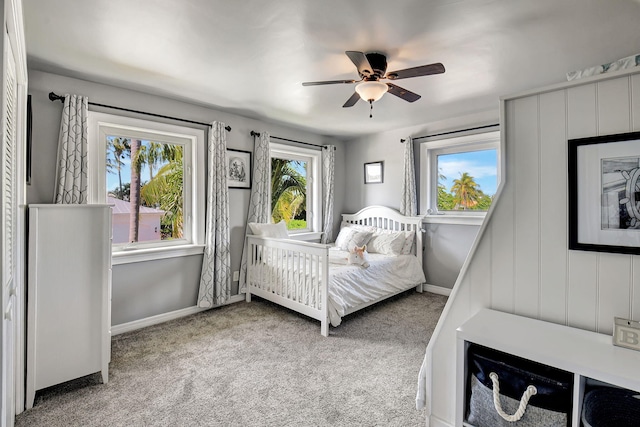 bedroom with carpet flooring, a ceiling fan, and baseboards