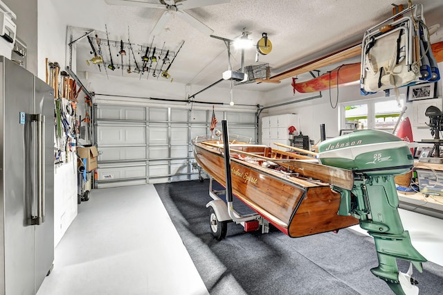 garage with high end fridge and a garage door opener