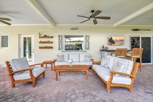 sunroom / solarium featuring beam ceiling and ceiling fan