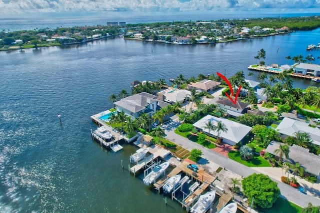 birds eye view of property with a water view