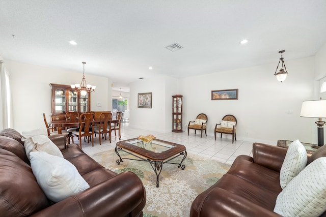 living room featuring light tile patterned flooring and a chandelier