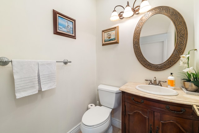 bathroom with toilet and vanity