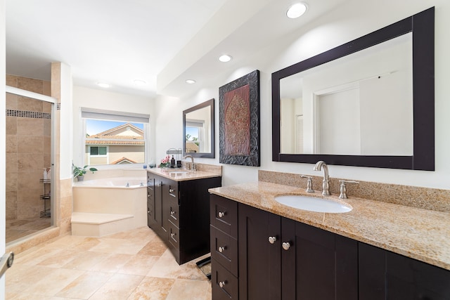 bathroom with plus walk in shower, tile patterned floors, and vanity