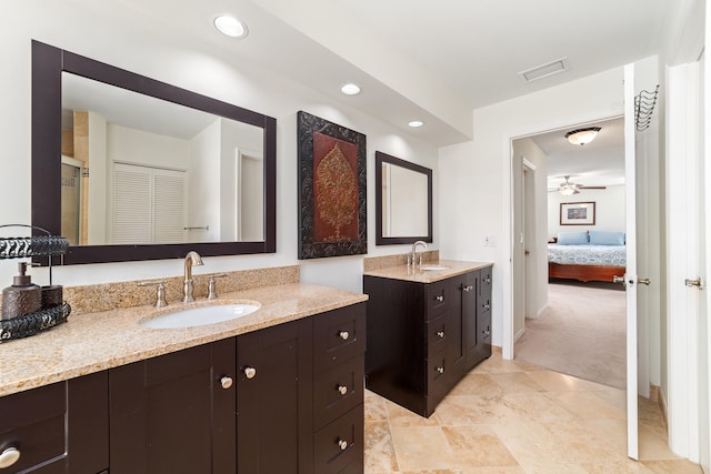 bathroom featuring ceiling fan, tile patterned flooring, an enclosed shower, and vanity