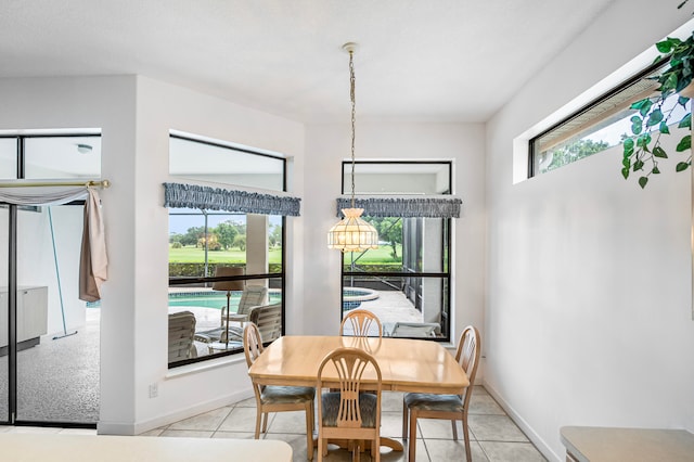 dining area with light tile patterned floors