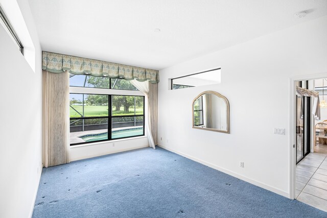 empty room with light colored carpet