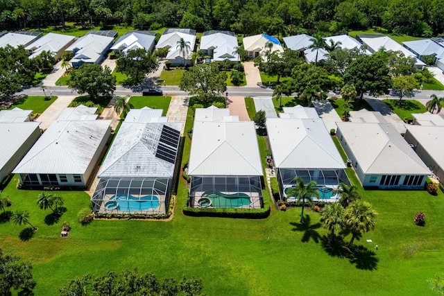 birds eye view of property with a residential view