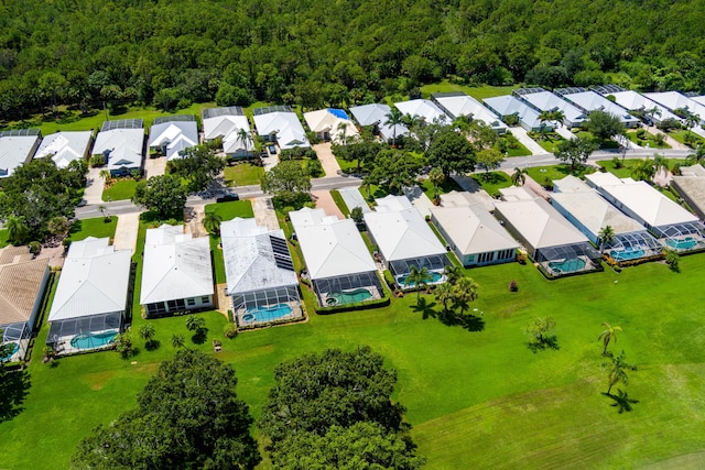 bird's eye view featuring a residential view and a view of trees