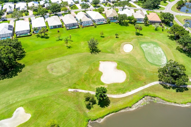 birds eye view of property featuring a residential view, view of golf course, and a water view