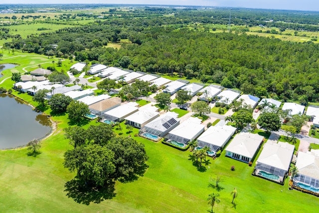 birds eye view of property featuring a water view, a residential view, and golf course view