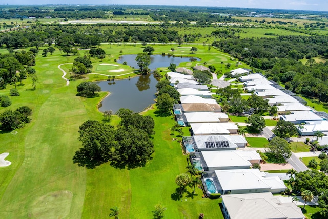 bird's eye view with view of golf course, a water view, and a residential view