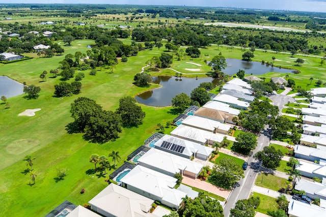 bird's eye view featuring a water view, a residential view, and golf course view