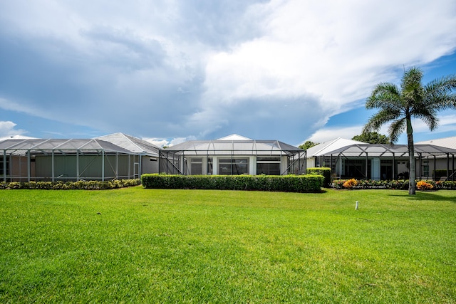 view of yard with a lanai