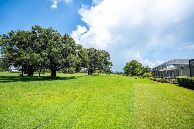 view of yard featuring a lanai