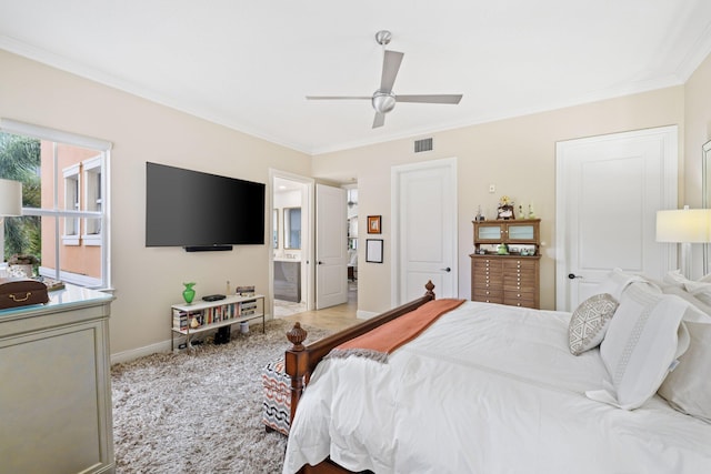 bedroom with ceiling fan, crown molding, and connected bathroom