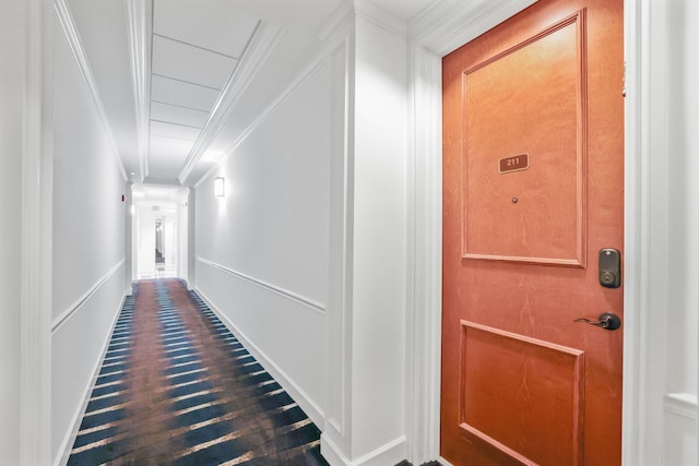 hall with crown molding and hardwood / wood-style floors