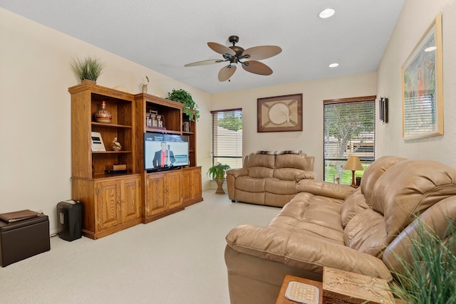 living room featuring ceiling fan and light carpet