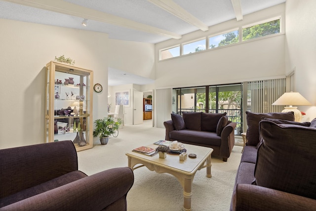 living area with high vaulted ceiling, beam ceiling, and light colored carpet