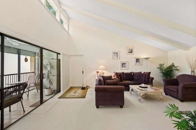 carpeted living room featuring beam ceiling and high vaulted ceiling