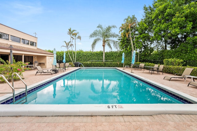 view of pool featuring a patio area