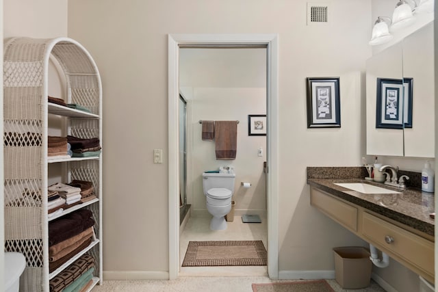 bathroom with toilet and vanity