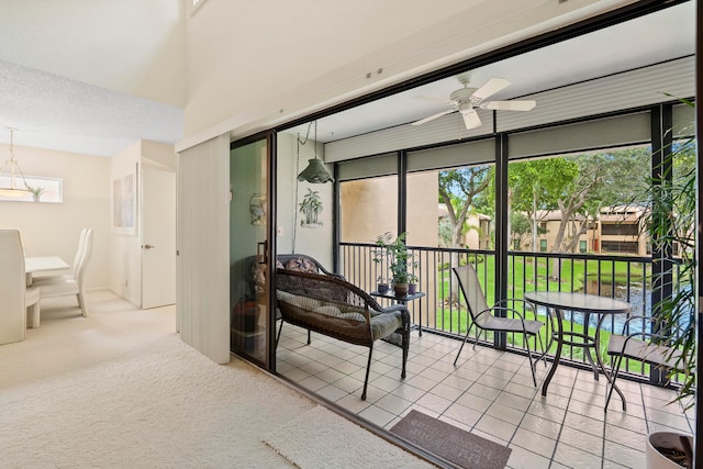 sunroom featuring ceiling fan