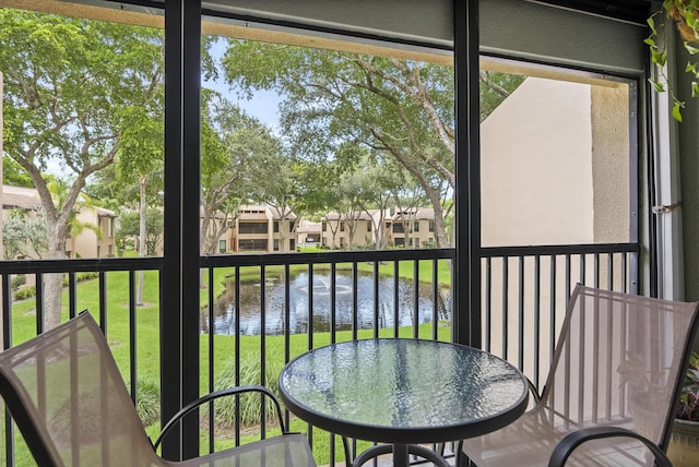 sunroom with a water view