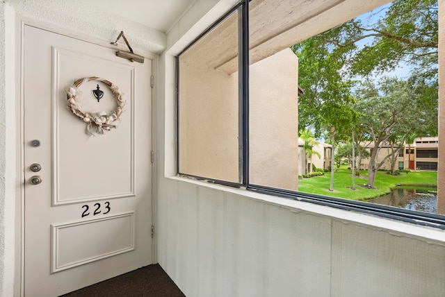 exterior space featuring plenty of natural light and a water view