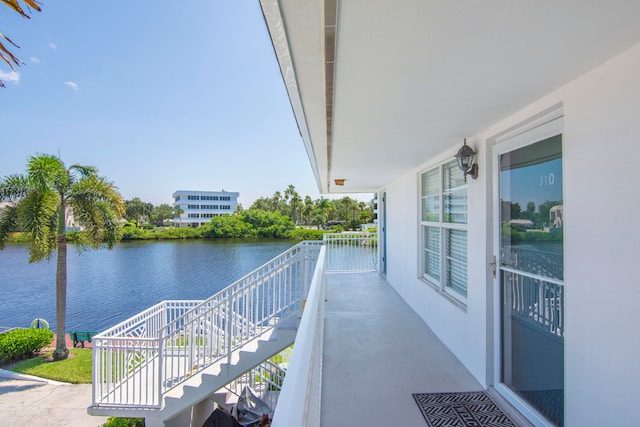 balcony featuring a water view