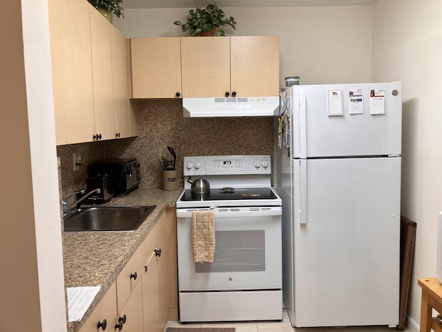 kitchen featuring light countertops, decorative backsplash, a sink, white appliances, and under cabinet range hood