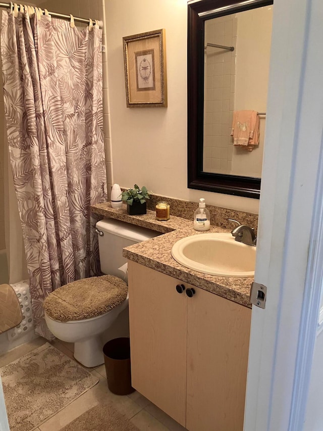 bathroom featuring shower / bathtub combination with curtain, vanity, toilet, and tile patterned floors