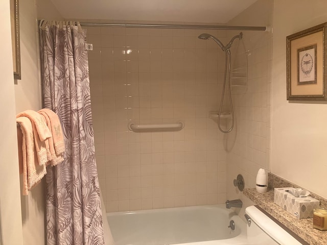 bathroom with toilet and shower / tub combo with curtain