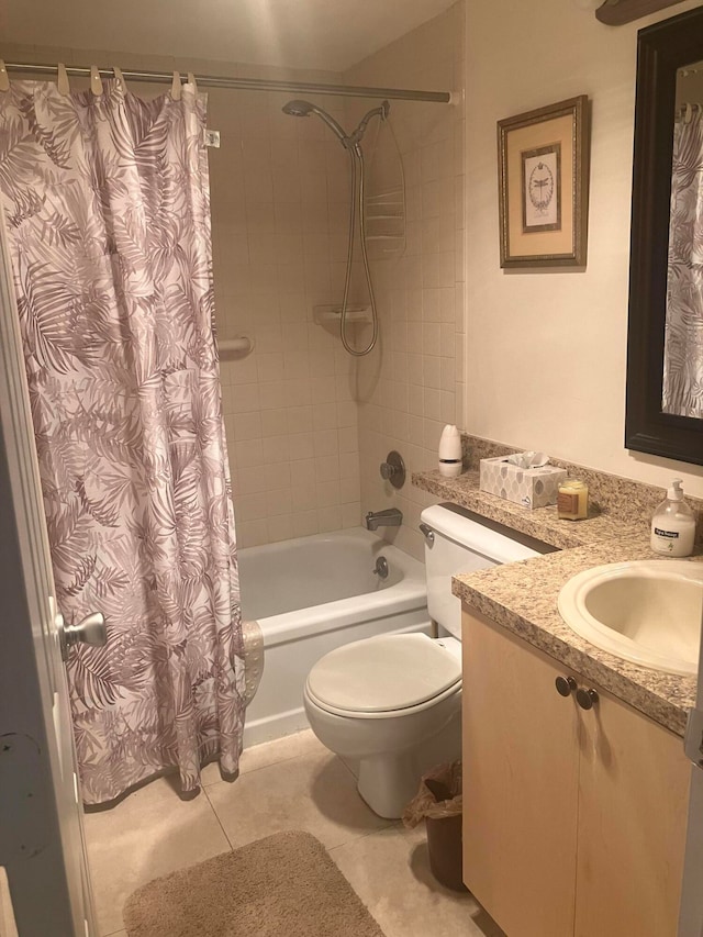 bathroom with toilet, shower / tub combo, vanity, and tile patterned floors