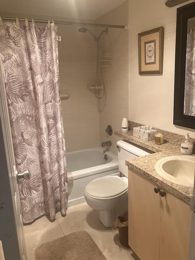 bathroom with vanity, tile patterned floors, toilet, and shower / tub combo
