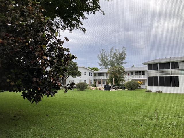 view of yard with a sunroom