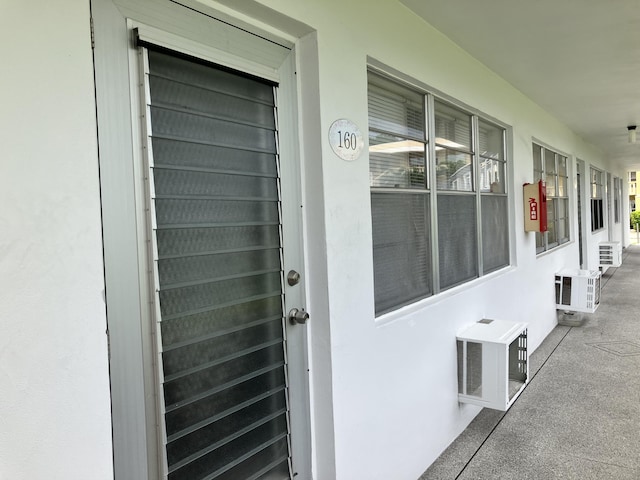 view of exterior entry with stucco siding