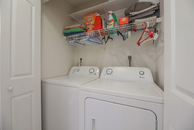 laundry area with washing machine and dryer