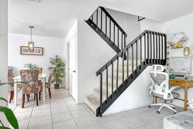 staircase with tile patterned floors