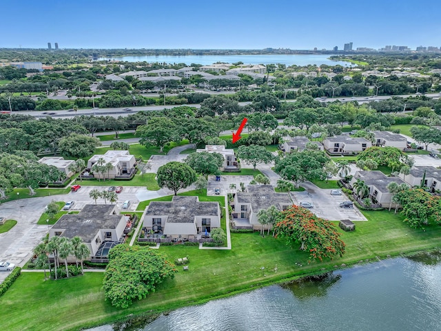 birds eye view of property featuring a residential view and a water view