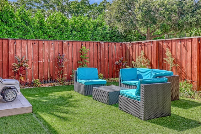 view of yard with a fenced backyard and an outdoor hangout area