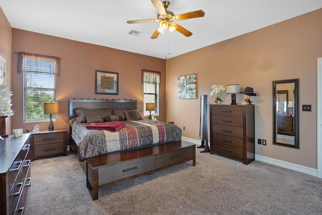 bedroom with ceiling fan and light colored carpet