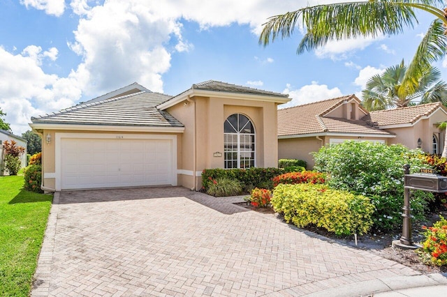 view of front of property with a garage