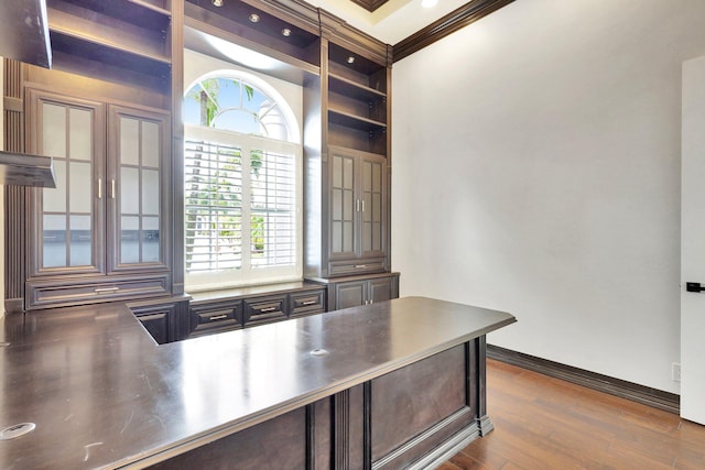 office space with crown molding and dark hardwood / wood-style flooring