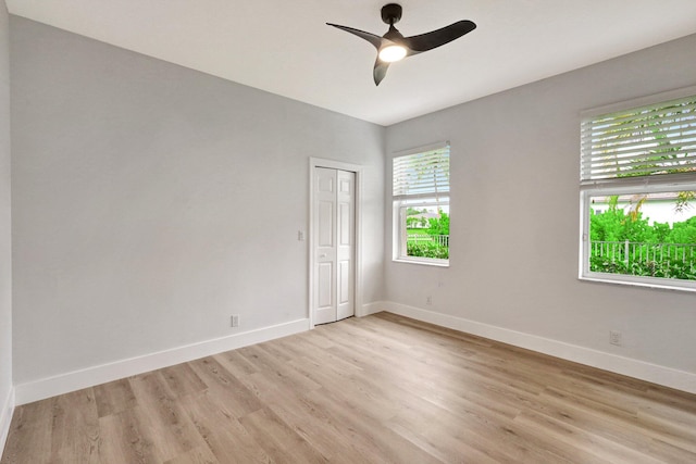 unfurnished room with ceiling fan and light hardwood / wood-style flooring