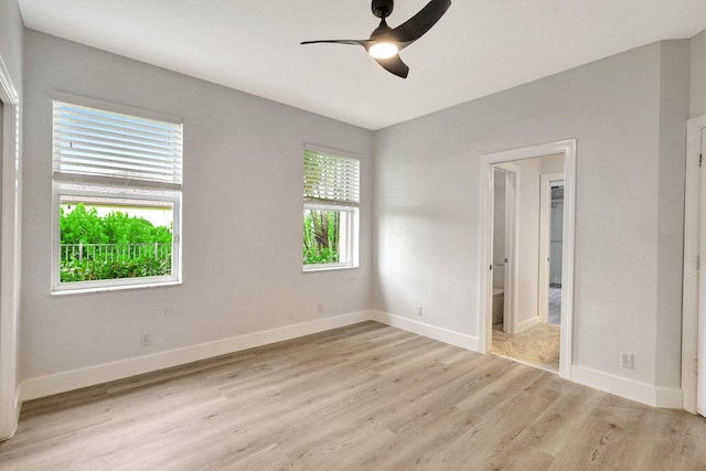 empty room featuring ceiling fan and light hardwood / wood-style flooring