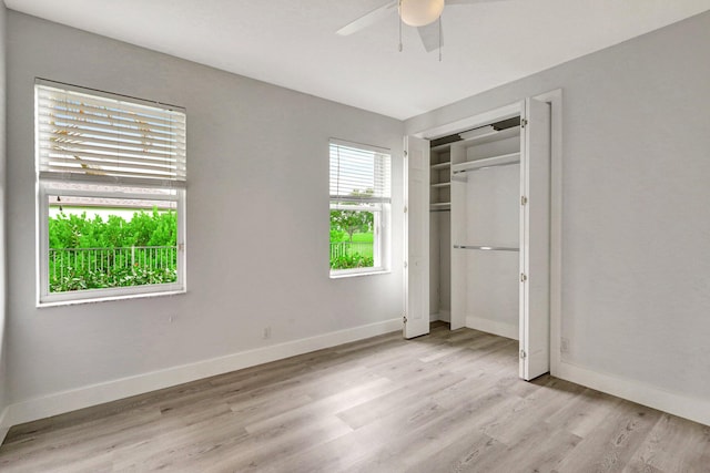 unfurnished bedroom with ceiling fan, a closet, and light hardwood / wood-style floors