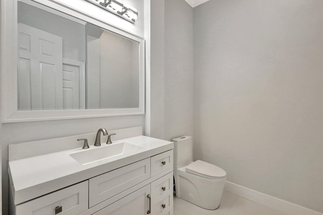 bathroom with tile patterned floors, vanity, and toilet