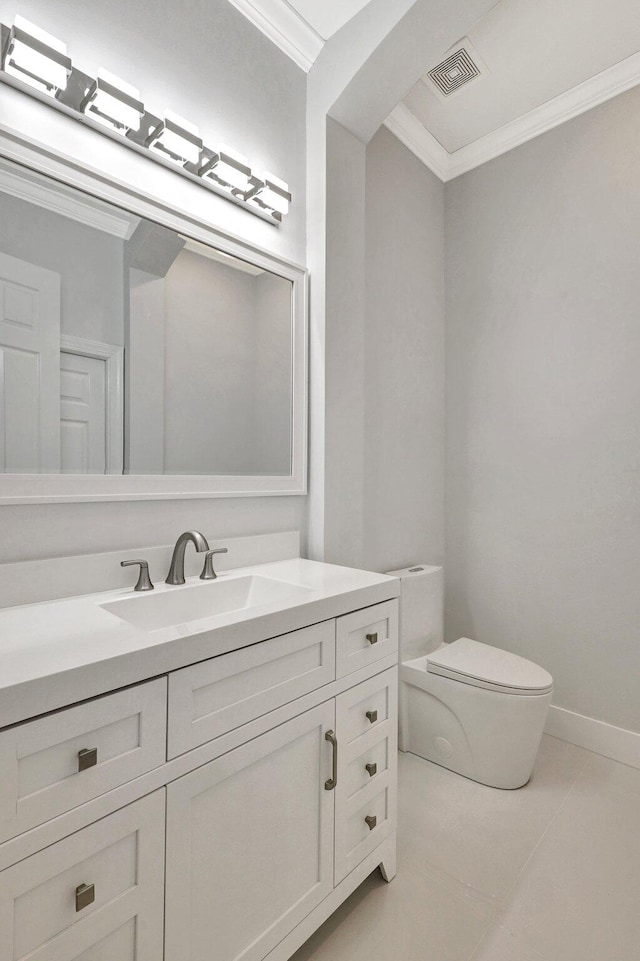 bathroom featuring tile patterned floors, vanity, toilet, and ornamental molding