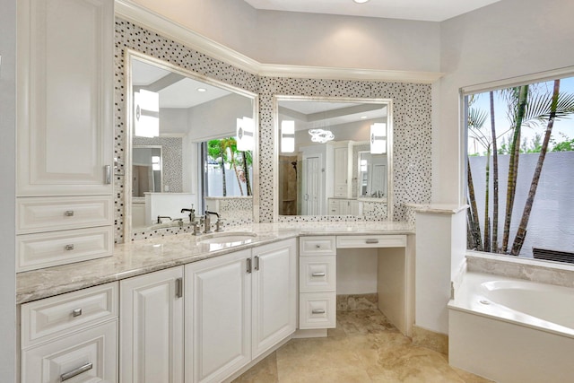 bathroom featuring vanity, a tub to relax in, a wealth of natural light, and backsplash